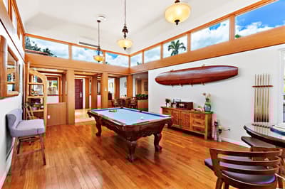 Tastefully appointed billards room includes hardwood floors, a beautiful pool table and casual, pub-style seating.